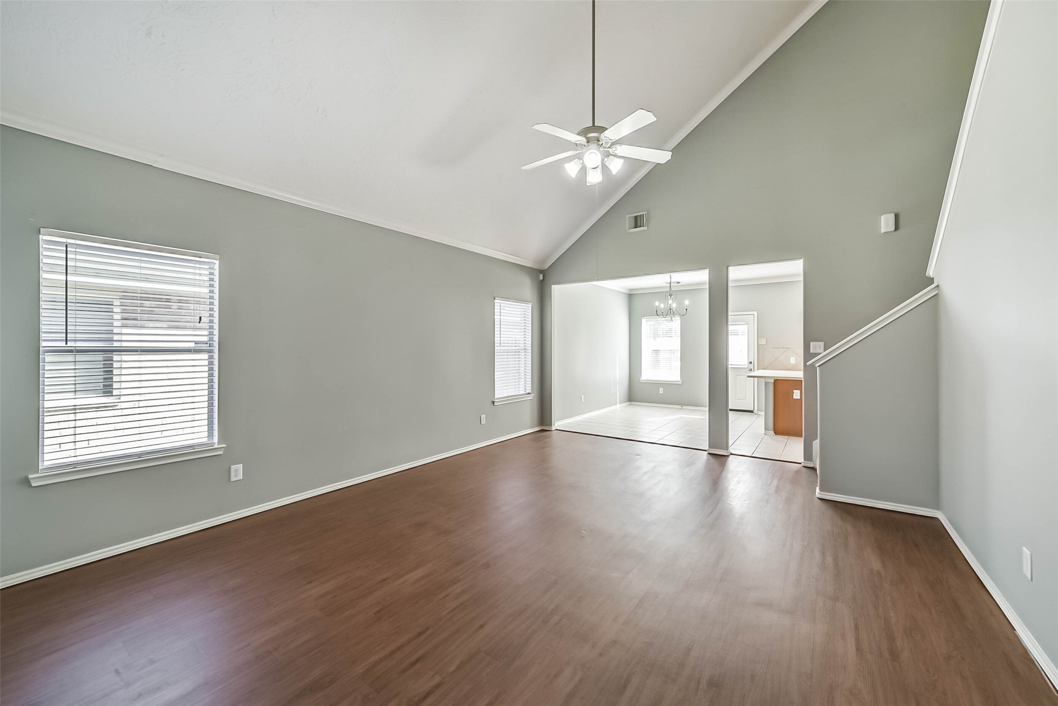 8726 Old Maple Lane Humble, TX 77338 - Photo 4 of 35 a view of an empty room with wooden floor and a window