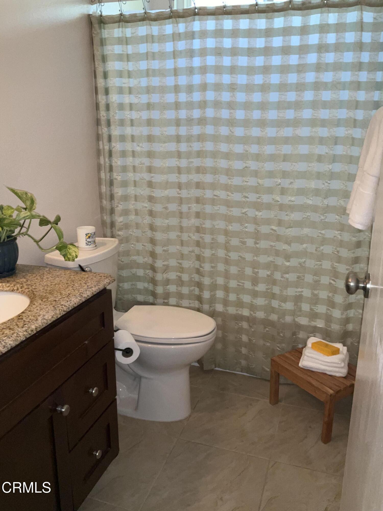 1101 Novato Drive Oxnard, CA 93035 - Photo 11 of 28 a bathroom with a granite countertop toilet and sink