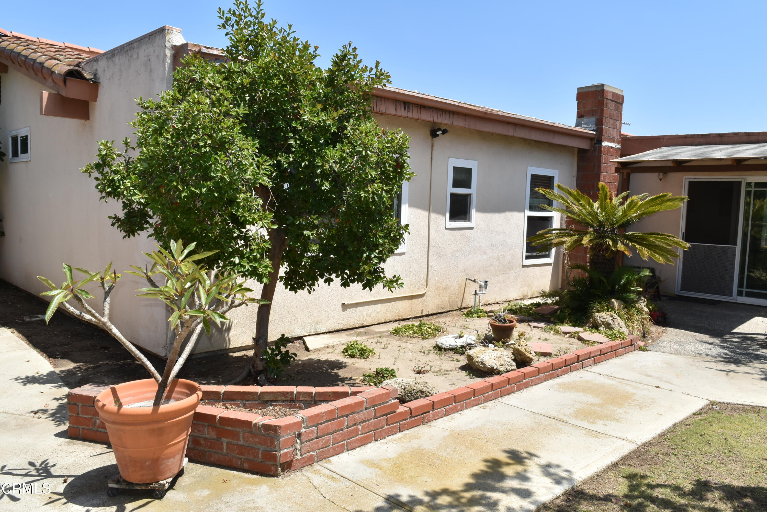1101 Novato Drive Oxnard, CA 93035 - Photo 20 of 28 a view of a backyard with plants and chairs