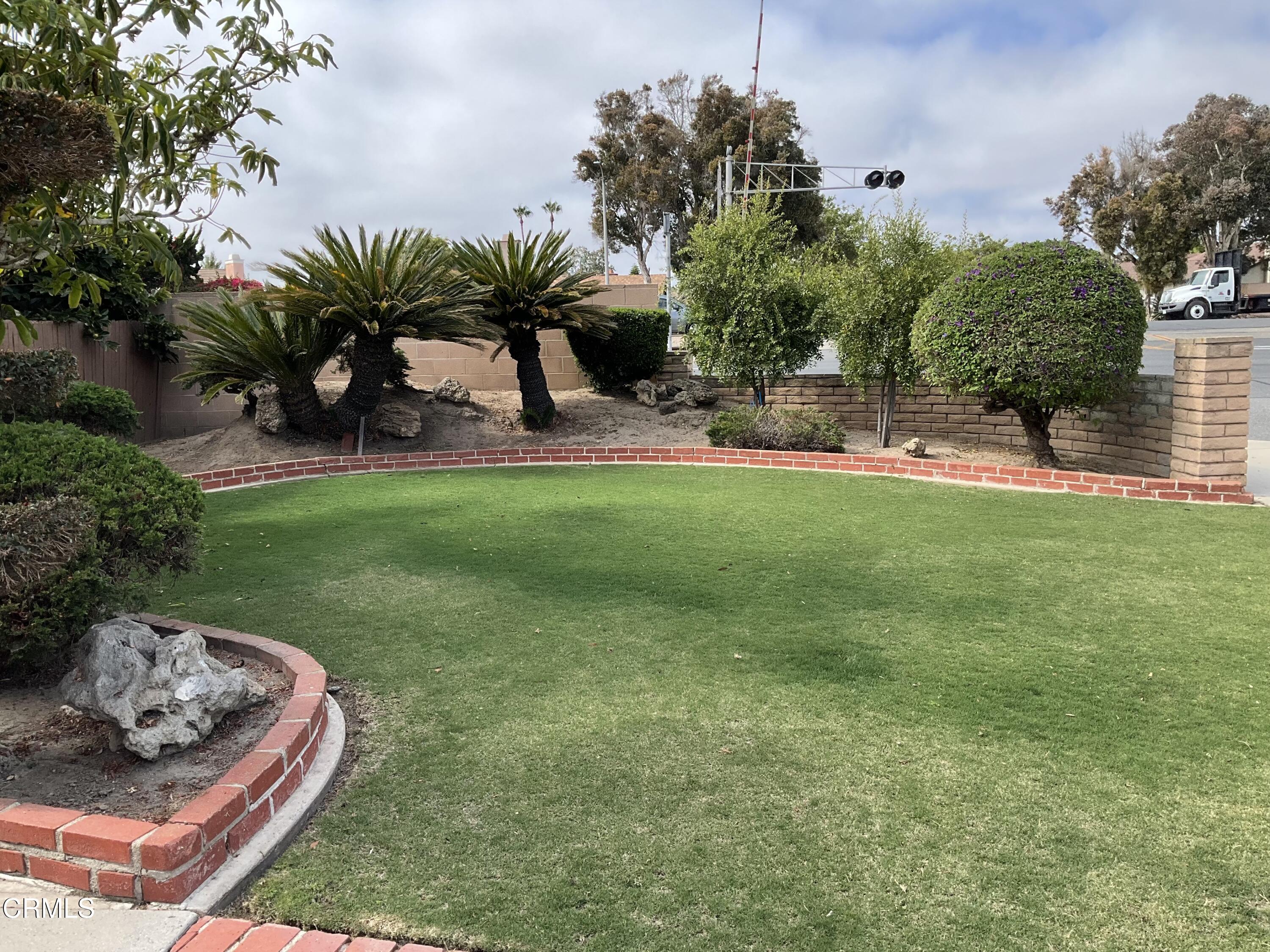 1101 Novato Drive Oxnard, CA 93035 - Photo 2 of 28 a view of a backyard with plants and a patio