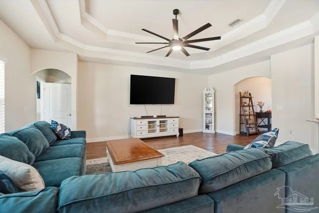a kitchen with lots of counter top space a sink appliances and cabinets