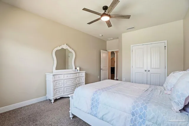 a view of walk in closet with clothes