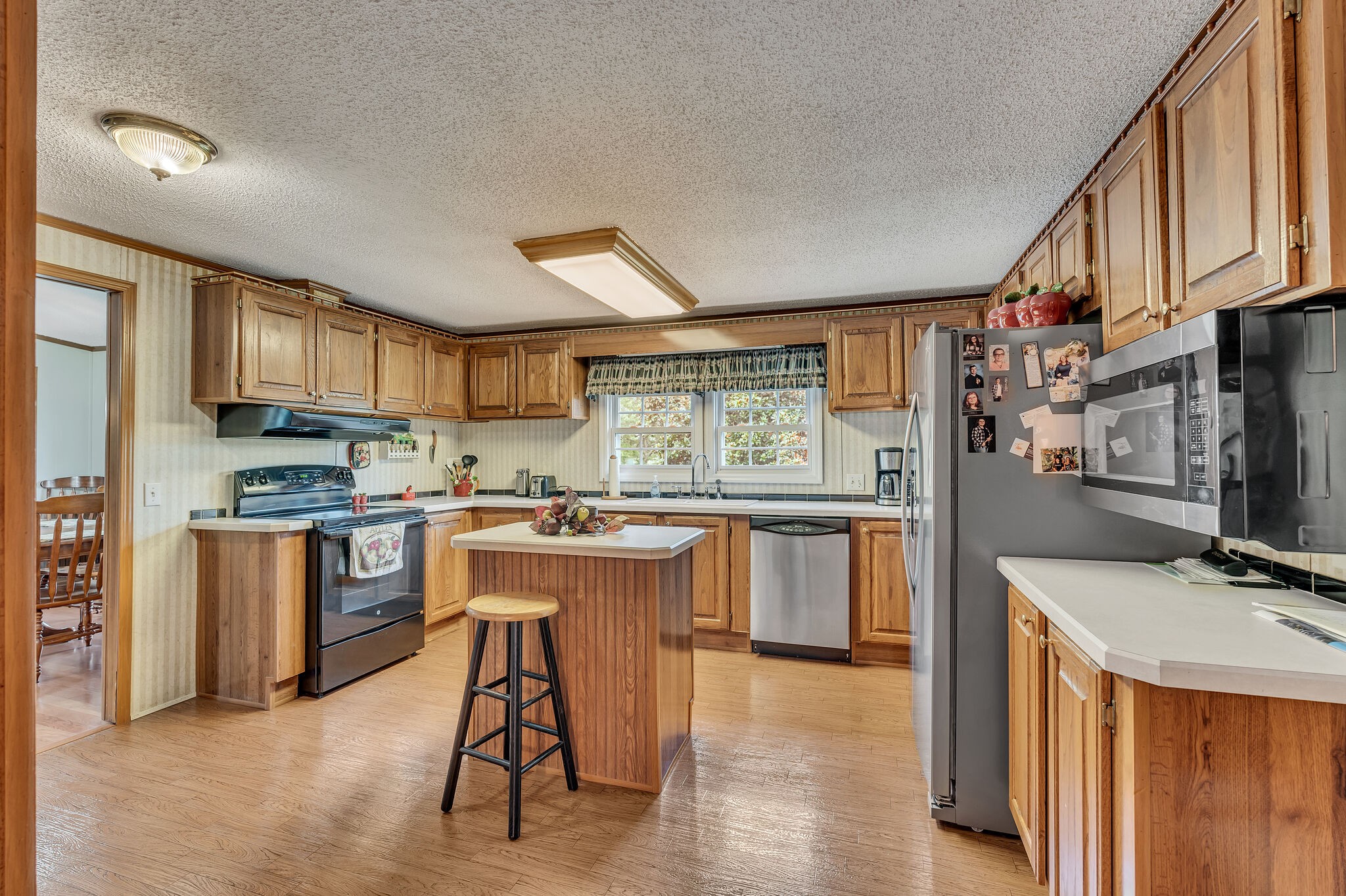 180 White Road Pulaski, TN 38478 - Photo 26 of 61 a kitchen with a sink stove cabinets and wooden floor