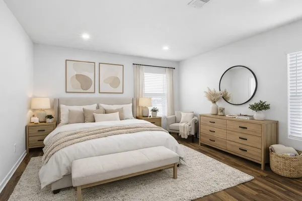 a bedroom with a bed and a dresser