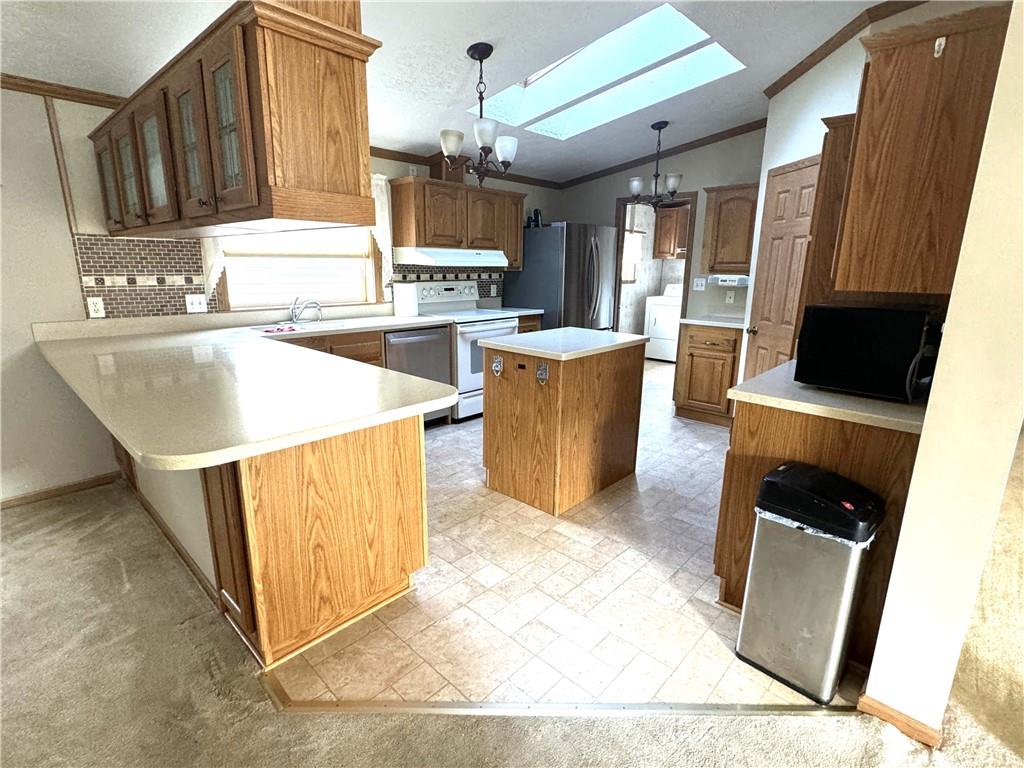 600 Deana Way Rochester, PA 15074 - Photo 7 of 22 a kitchen with a sink a stove a refrigerator and cabinets