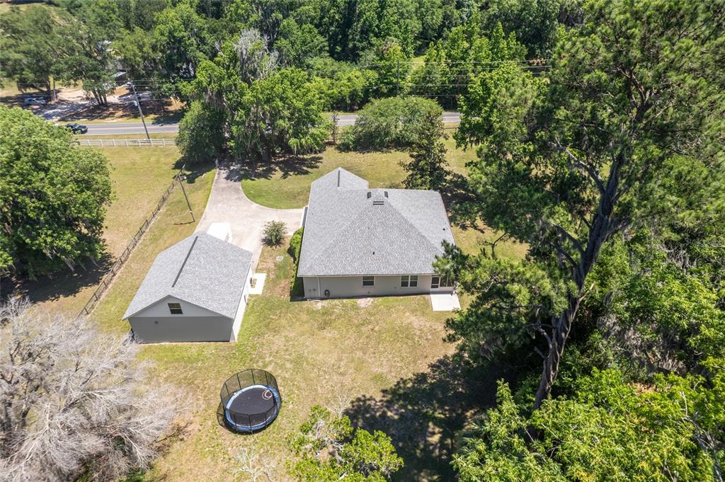 4735 Southeast 112th Street Road Belleview, FL 34420 - Photo 67 of 73 an aerial view of residential houses with outdoor space