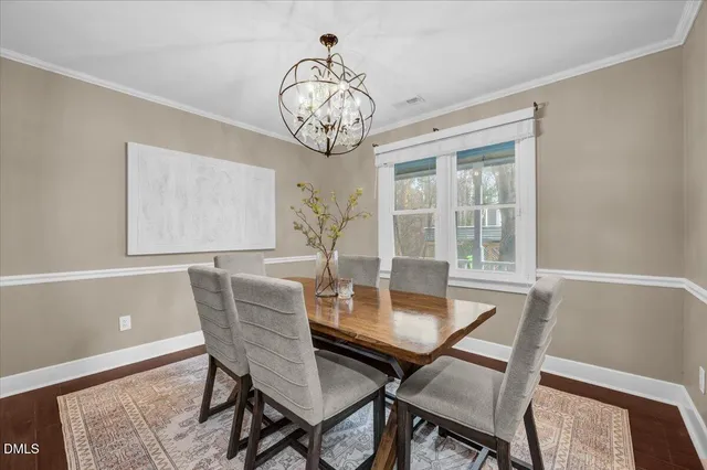 a view of a porch with wooden floor and wooden fence