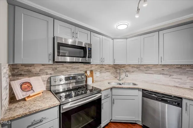 a view of a livingroom with furniture window and wooden floor
