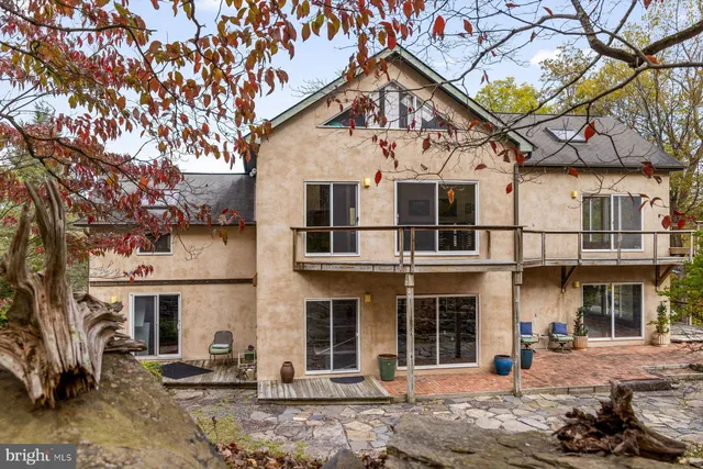 a front view of a house with parking area