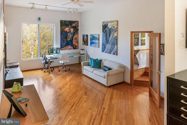 a bathroom with a granite countertop sink and a bathtub