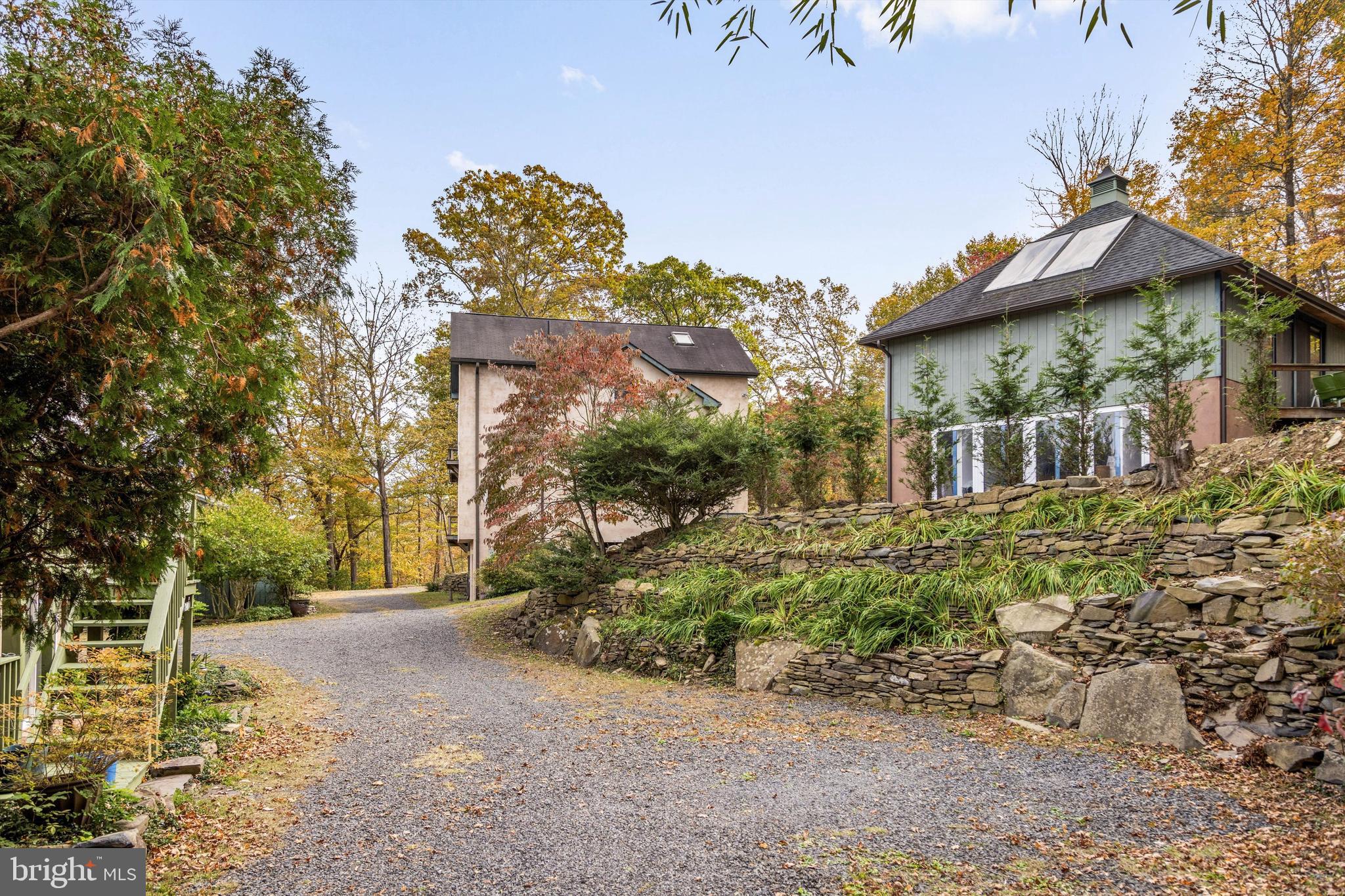 7640 Tohickon Hill Road Pipersville, PA 18947 - Photo 27 of 34 a front view of a house with garden