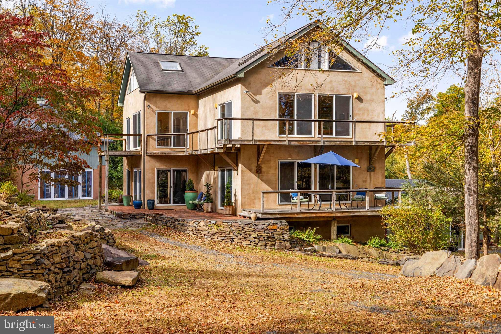 7640 Tohickon Hill Road Pipersville, PA 18947 - Photo 7 of 34 a front view of a house with a yard