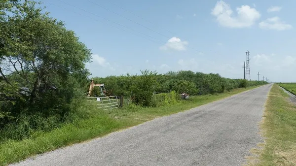 a view of a street both of side of green space