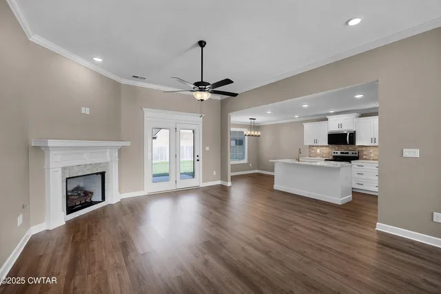 a view of kitchen with cabinets and wooden floor