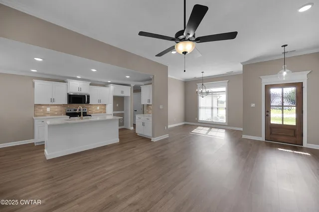 a view of kitchen with refrigerator and window