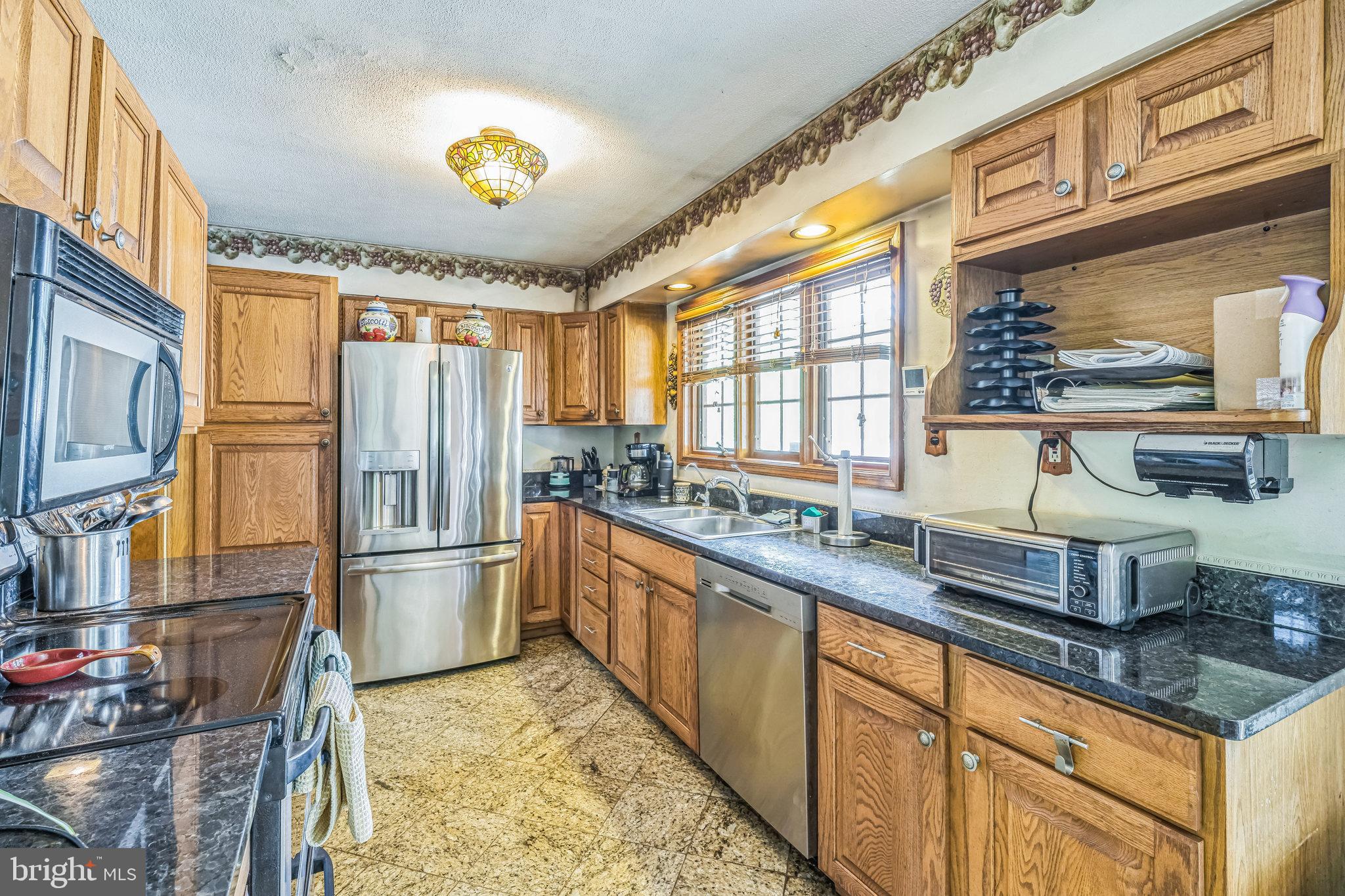 430 King George Road Cherry Hill, NJ 08034 - Photo 8 of 26 a kitchen with stainless steel appliances granite countertop a refrigerator and stove