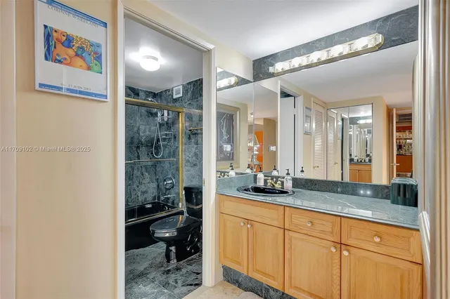 a bathroom with a sink and mirror
