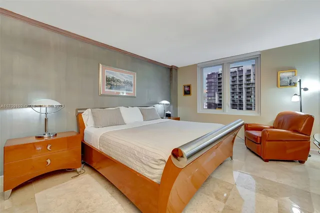 a bedroom with bed and a couch