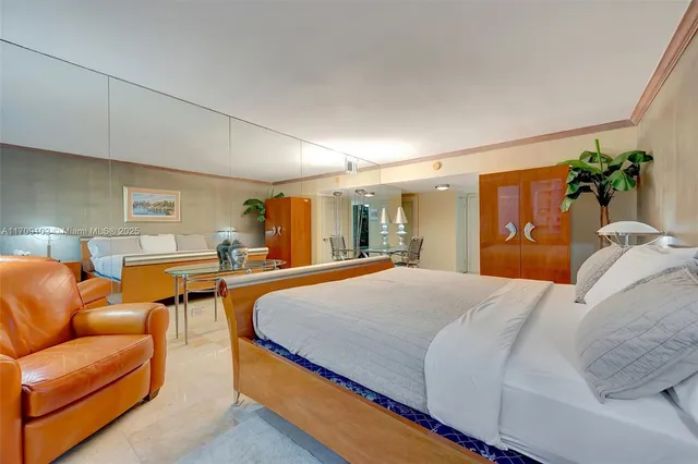 a balcony with table and chairs