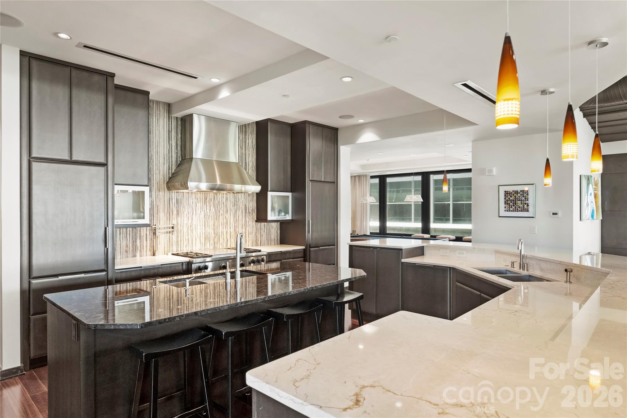 139 South Tryon Street, Unit 6 Charlotte, NC 28202 - Photo 19 of 47 a kitchen with counter top space cabinets and stainless steel appliances
