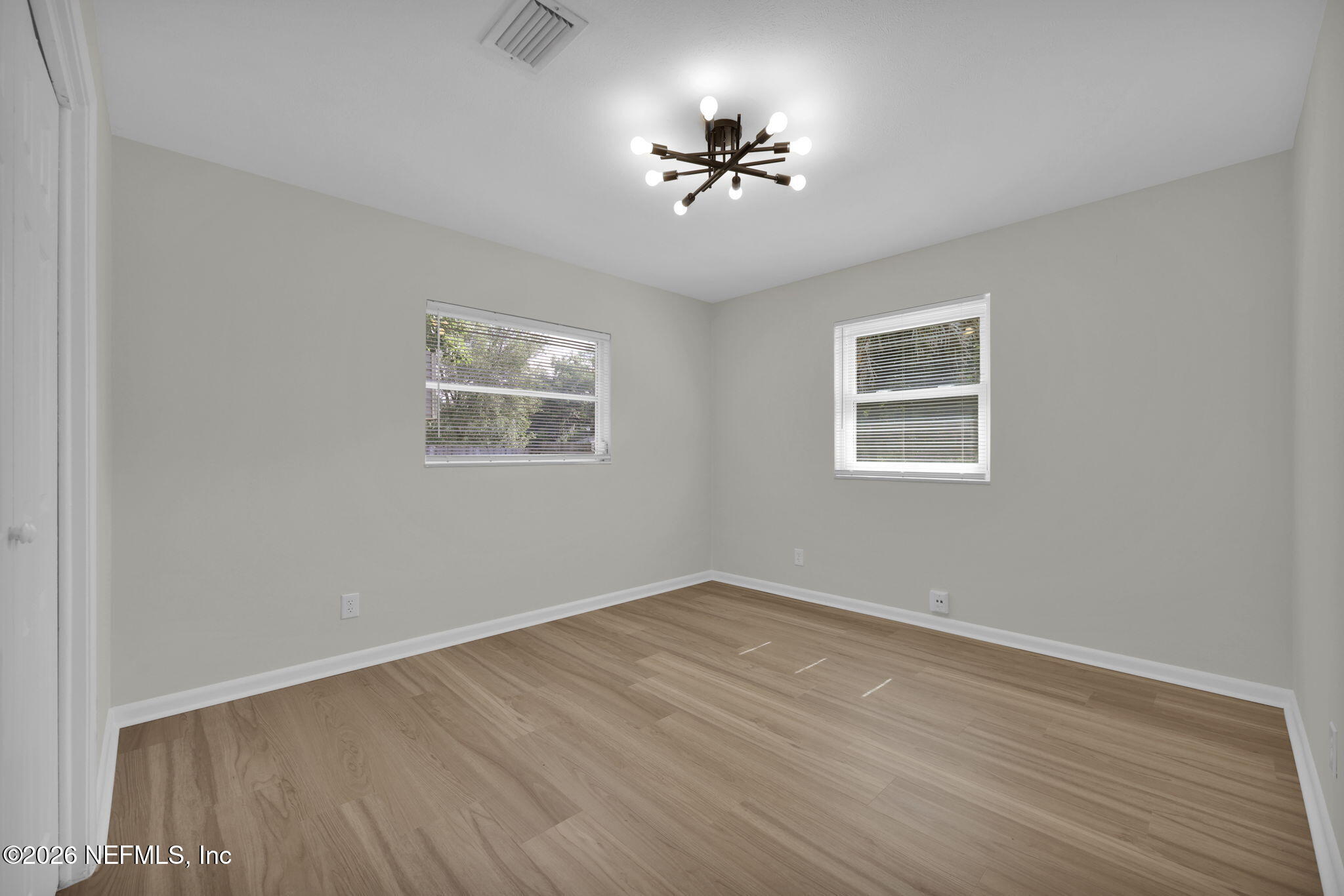 8544 Sanchez Road Jacksonville, FL 32217 - Photo 30 of 46 a view of empty room with wooden floor