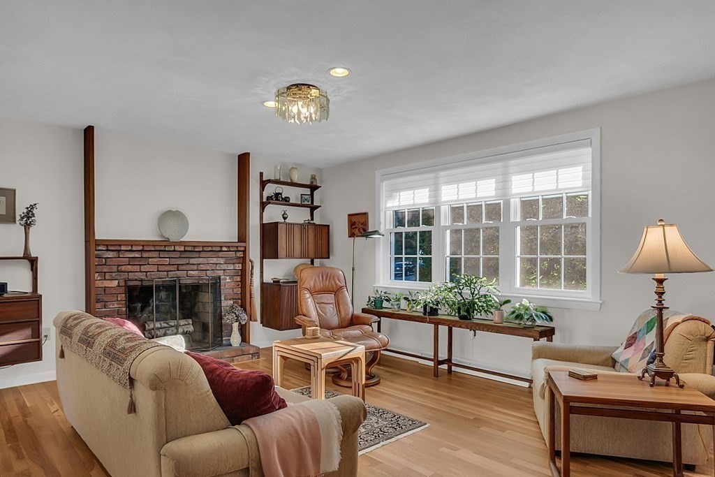 3 Johnson Road Chelmsford, MA 01824 - Photo 13 of 42 a living room with furniture and a fireplace
