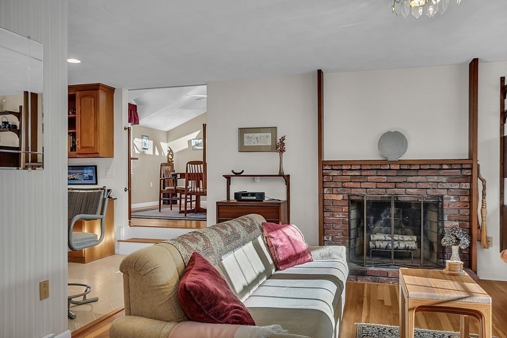 3 Johnson Road Chelmsford, MA 01824 - Photo 14 of 42 a living room with furniture and a fireplace