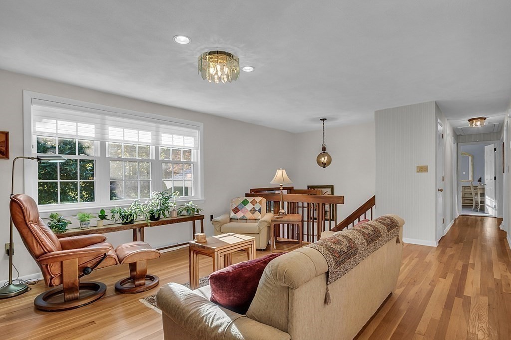 3 Johnson Road Chelmsford, MA 01824 - Photo 15 of 42 a living room with furniture a table and a large window
