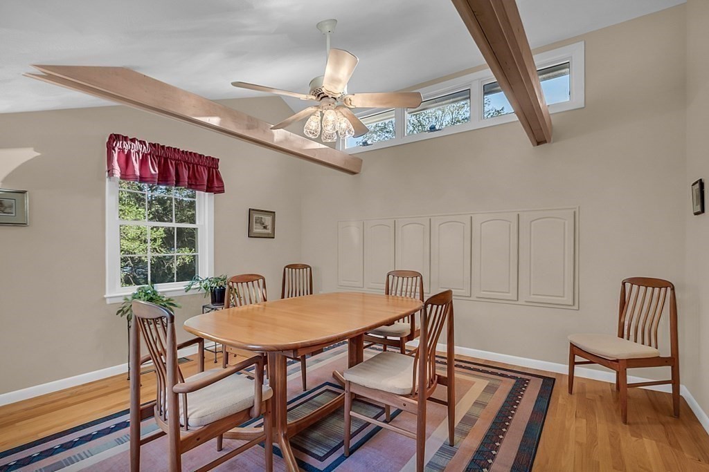 3 Johnson Road Chelmsford, MA 01824 - Photo 21 of 42 a view of a dining room with furniture a chandelier and wooden floor