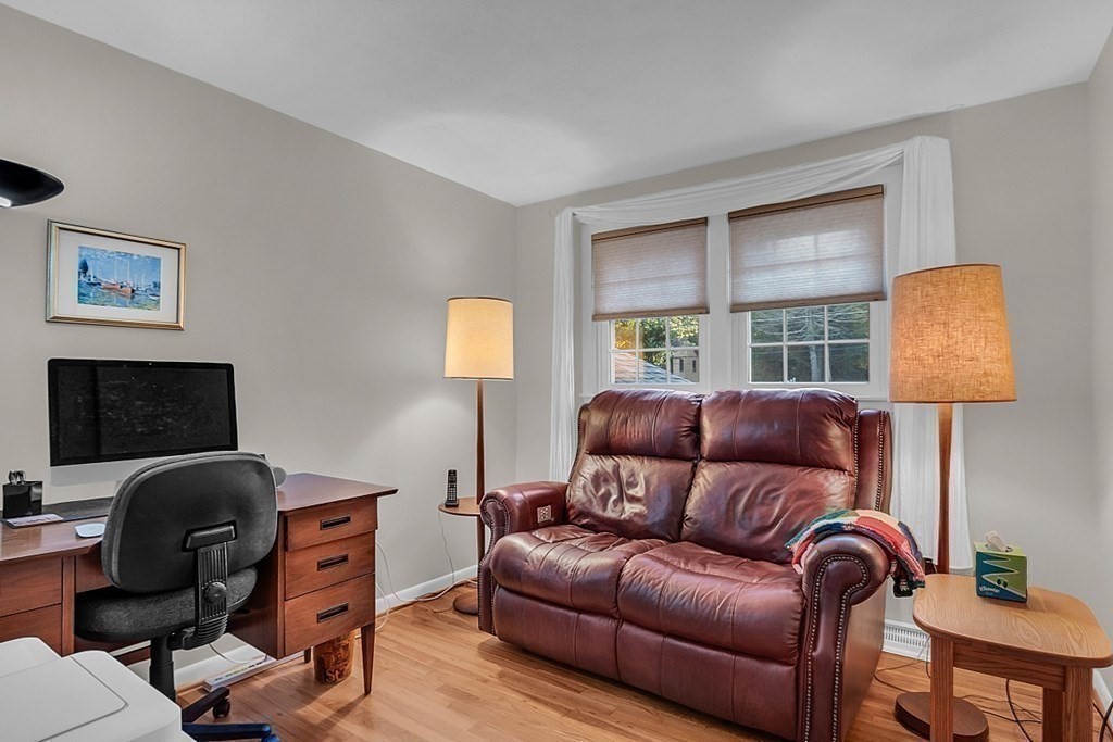 3 Johnson Road Chelmsford, MA 01824 - Photo 24 of 42 a living room with couches a couch and a lamp next to a window