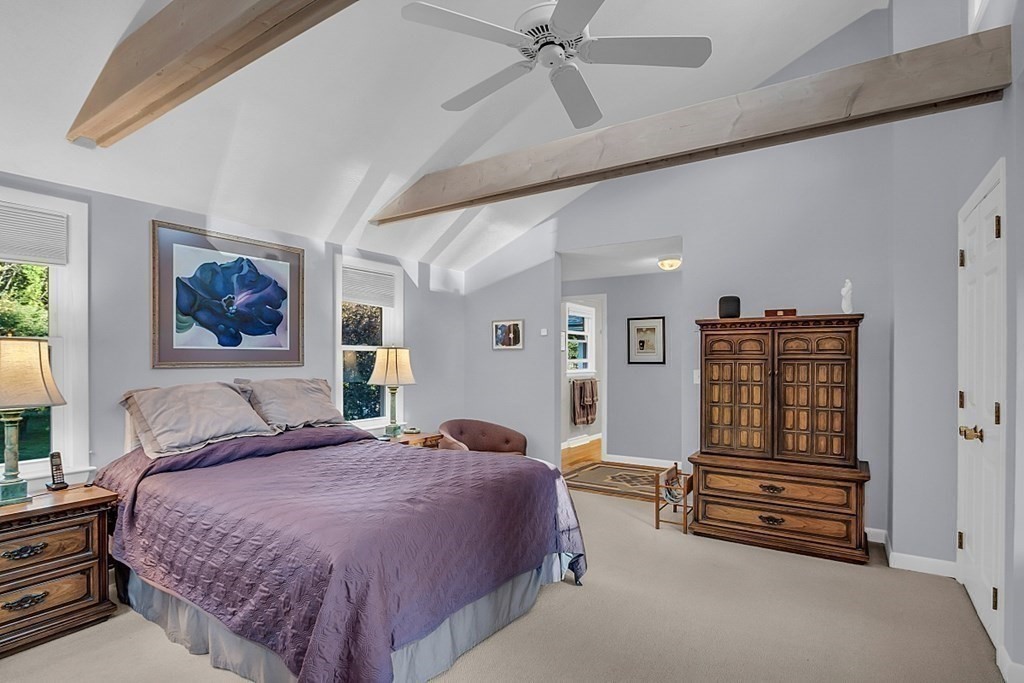 3 Johnson Road Chelmsford, MA 01824 - Photo 29 of 42 a spacious bedroom with a bed and a chandelier