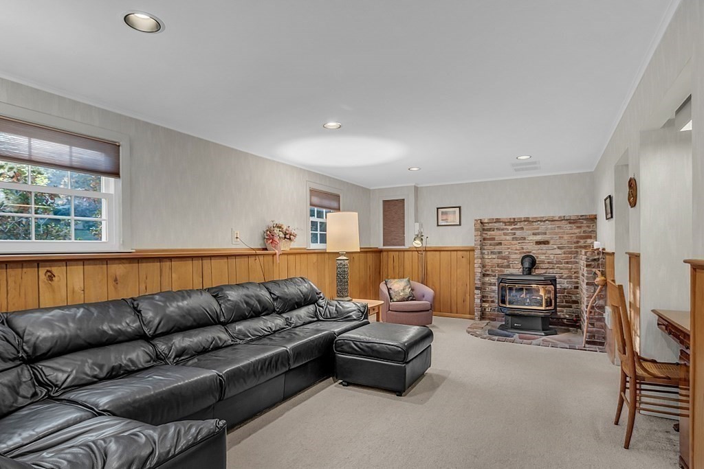 3 Johnson Road Chelmsford, MA 01824 - Photo 31 of 42 a living room with furniture and a flat screen tv