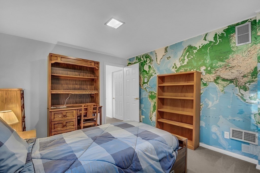 3 Johnson Road Chelmsford, MA 01824 - Photo 37 of 42 a bedroom with a bed and a television