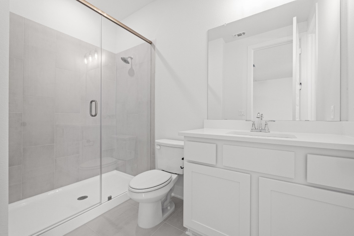 248 Star Rush Trail Georgetown, TX 78633 - Photo 11 of 27 a bathroom with a sink a toilet and shower