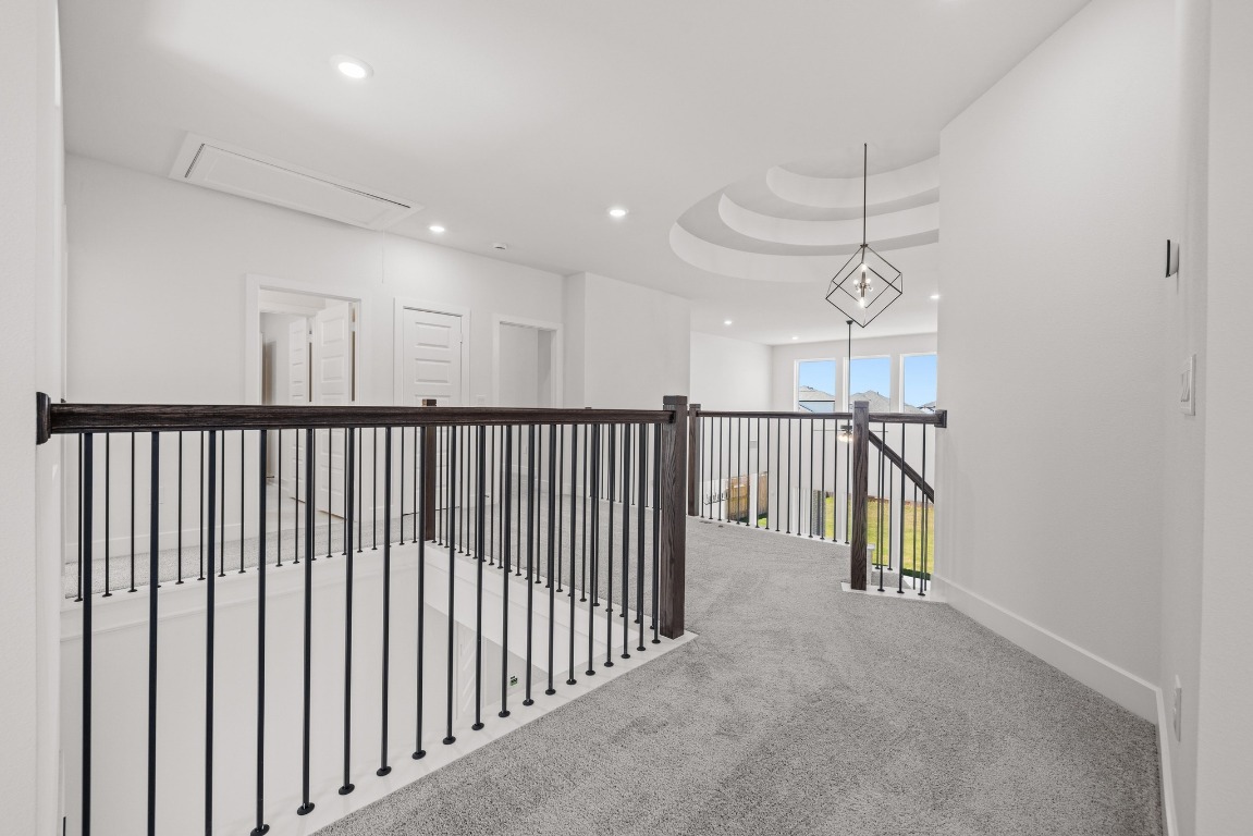 248 Star Rush Trail Georgetown, TX 78633 - Photo 13 of 27 a view of a hallway with wooden floor