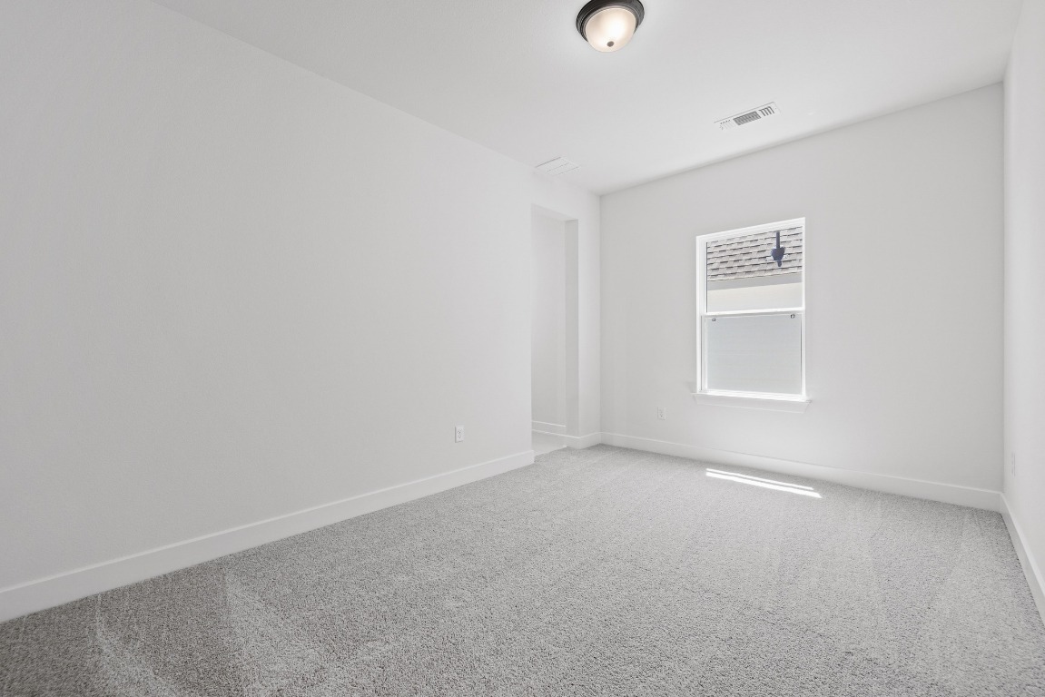 248 Star Rush Trail Georgetown, TX 78633 - Photo 15 of 27 an empty room with a window