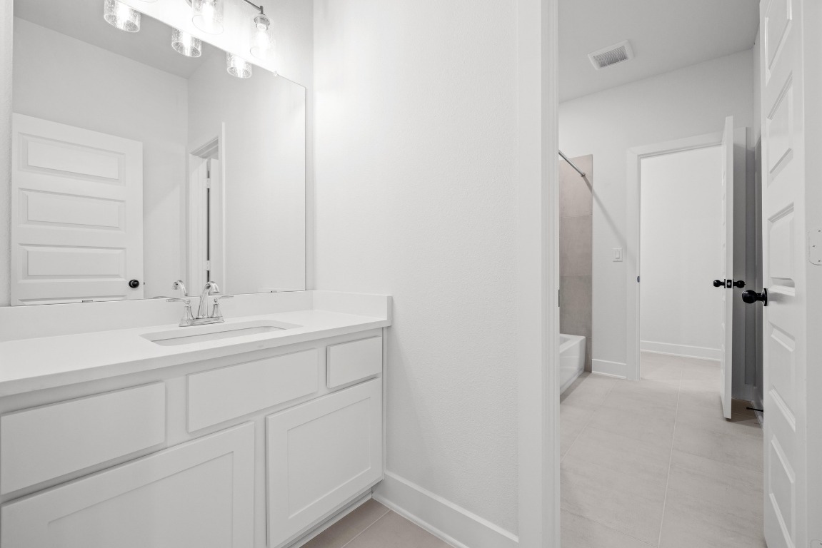 248 Star Rush Trail Georgetown, TX 78633 - Photo 18 of 27 a bathroom with a sink and a mirror