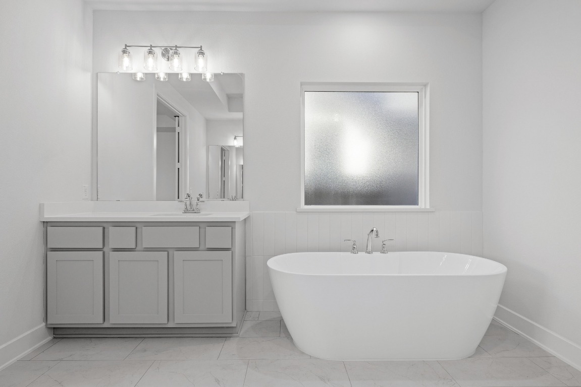 248 Star Rush Trail Georgetown, TX 78633 - Photo 9 of 27 a bathroom with a sink and a mirror