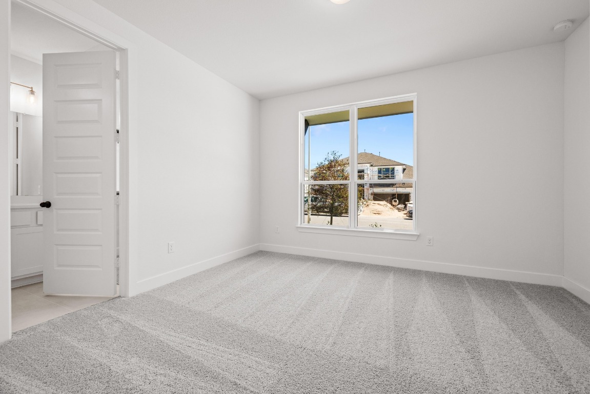 248 Star Rush Trail Georgetown, TX 78633 - Photo 10 of 27 a view of a livingroom with an empty space and a window