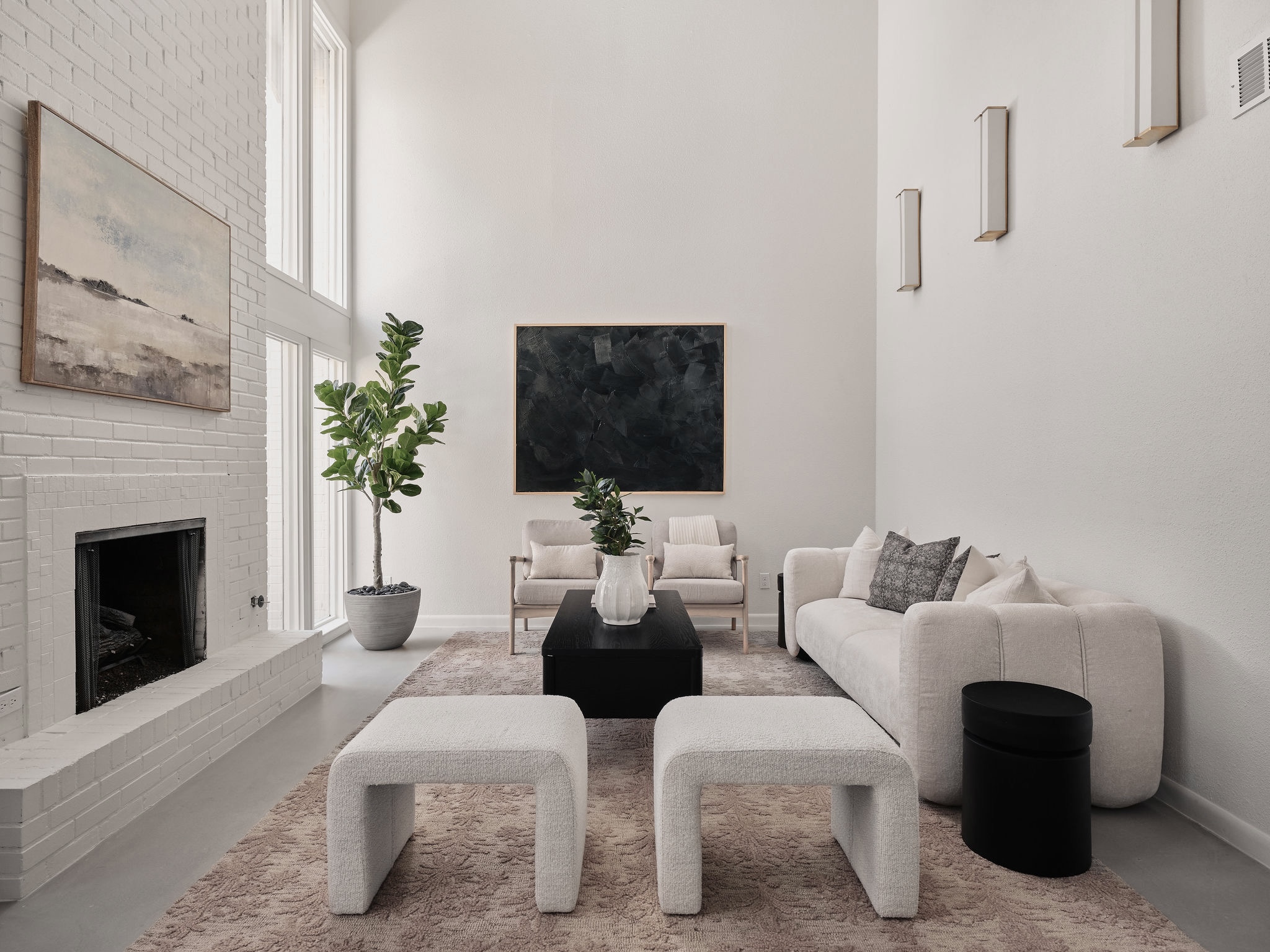 3416 Pecos Street, Unit B Austin, TX 78703 - Photo 1 of 23 Living area featuring a high ceiling, a brick fireplace, and concrete flooring