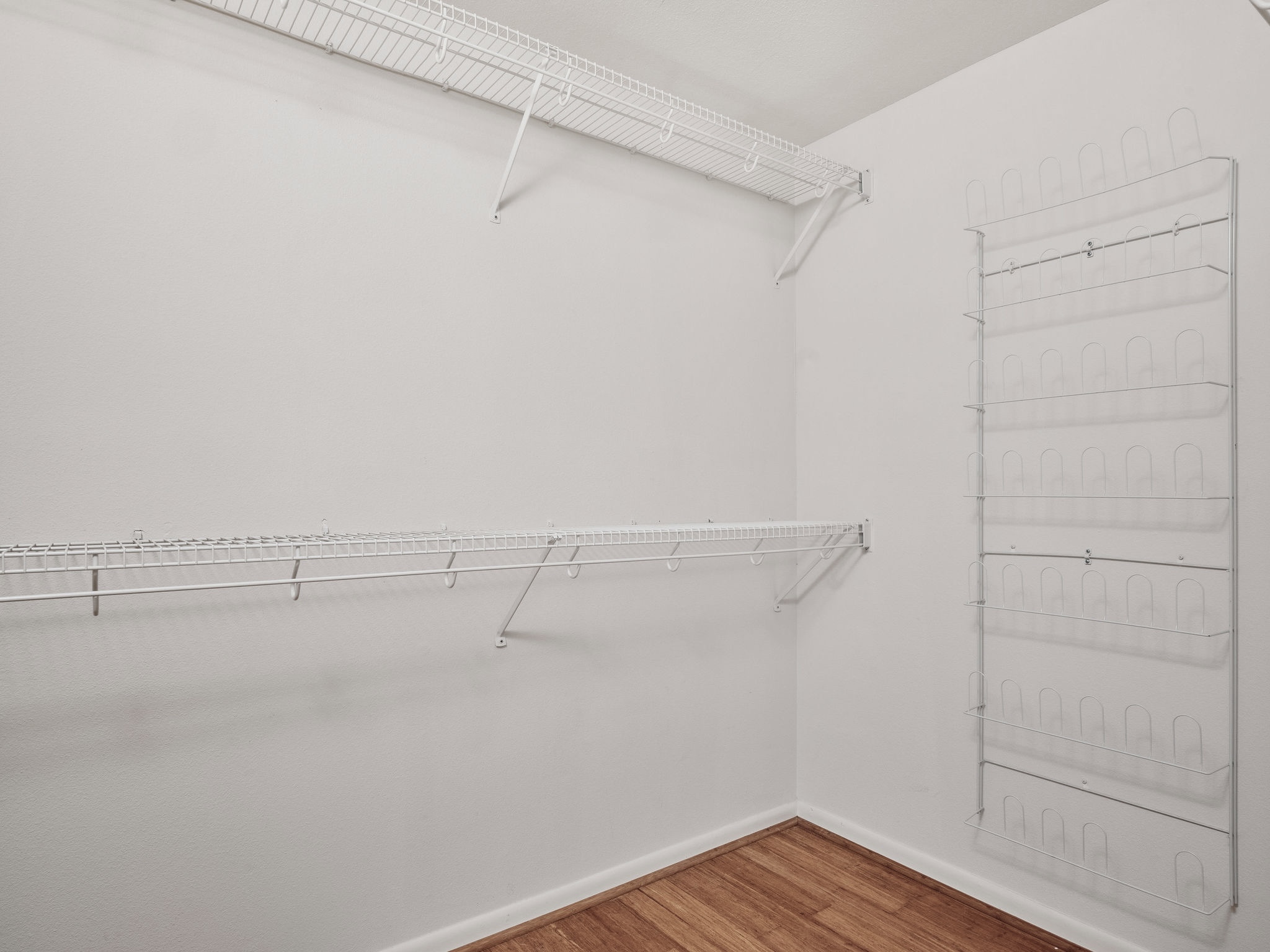 3416 Pecos Street, Unit B Austin, TX 78703 - Photo 11 of 23 Walk in closet with light wood-style floors
