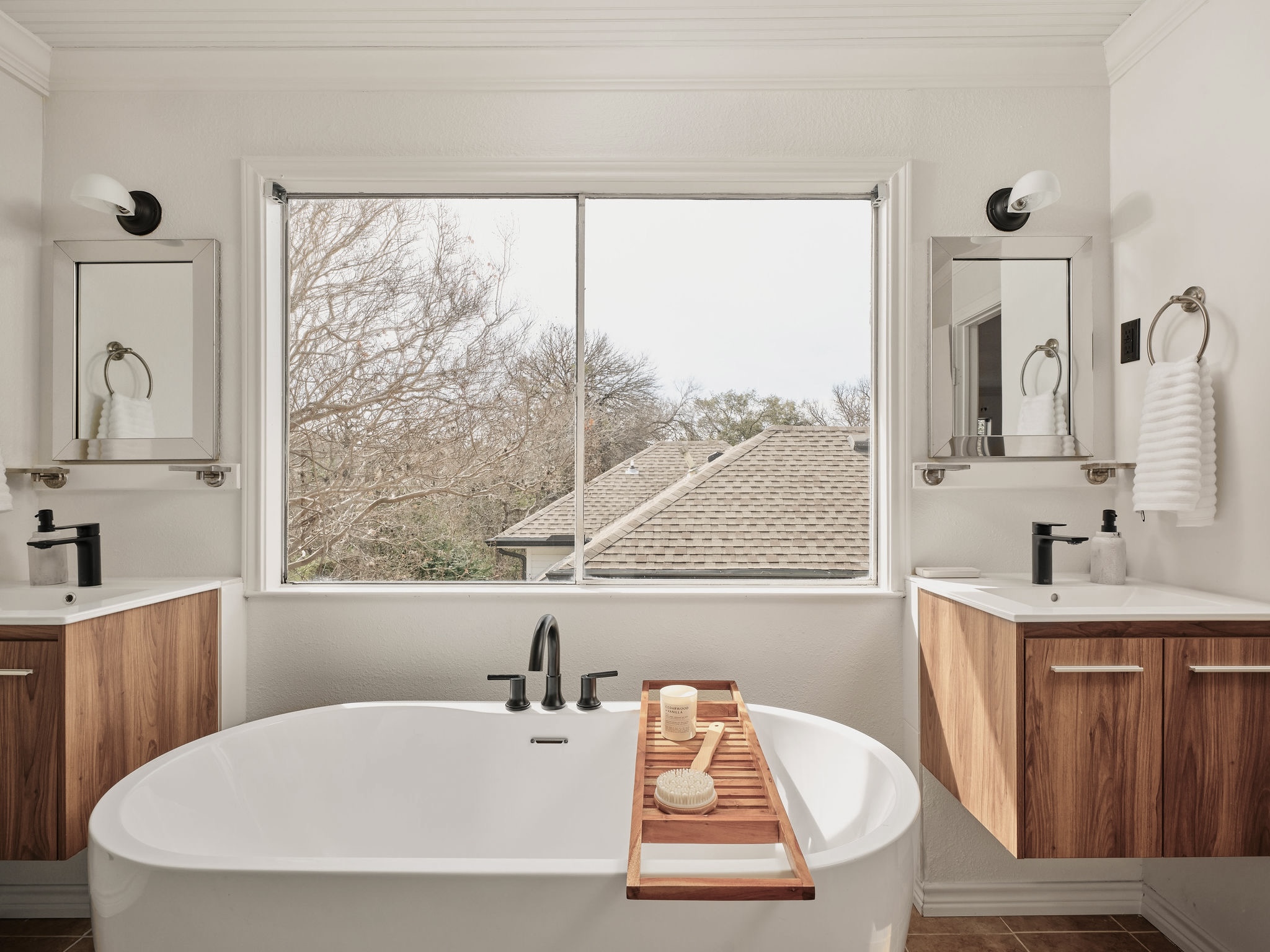 3416 Pecos Street, Unit B Austin, TX 78703 - Photo 14 of 23 Bathroom with vanity, crown molding, dark tile patterned flooring, and a soaking tub