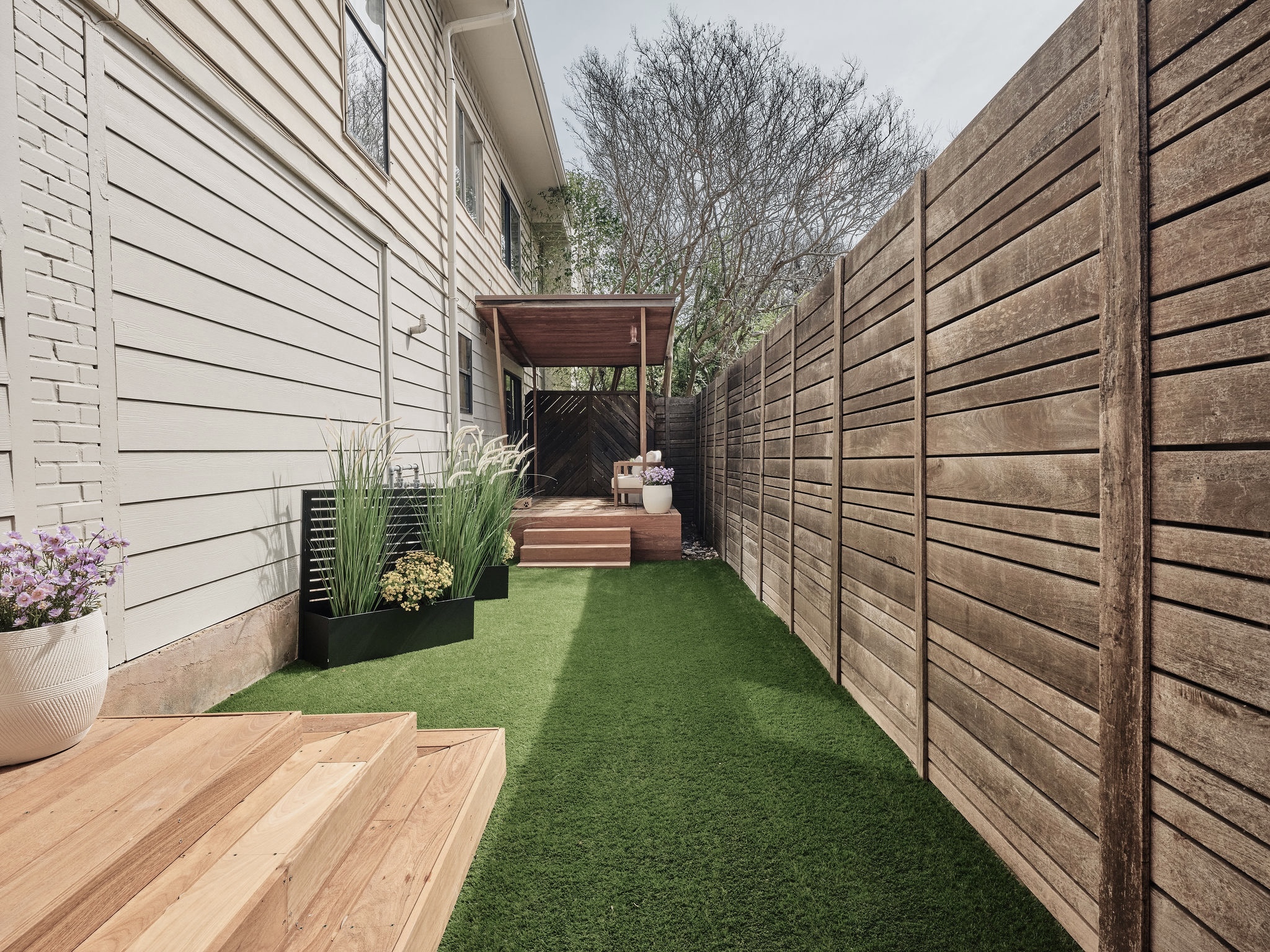 3416 Pecos Street, Unit B Austin, TX 78703 - Photo 20 of 23 Fenced backyard featuring a deck