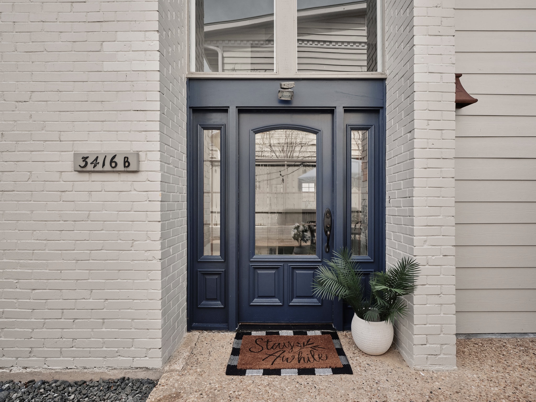 3416 Pecos Street, Unit B Austin, TX 78703 - Photo 23 of 23 View of exterior entry with brick siding