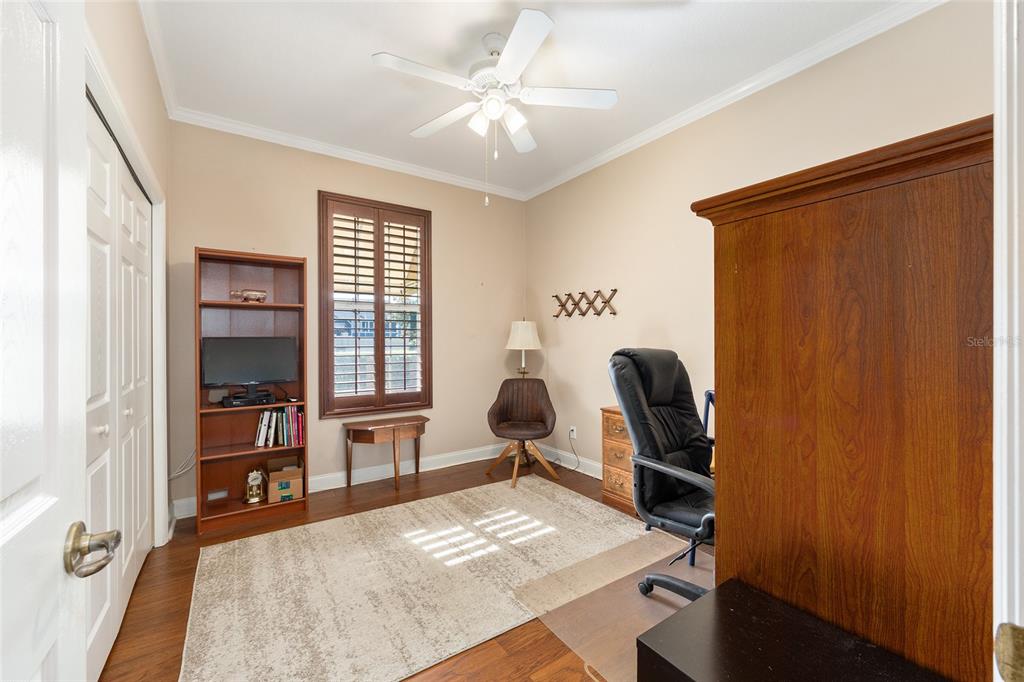 3304 Southwest 38th Street Ocala, FL 34474 - Photo 8 of 21 a bedroom with furniture and a window