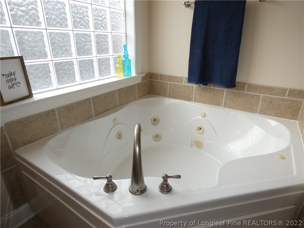 65 Falling Water Road Spring Lake, NC 28390 - Photo 23 of 47 a bathroom with a bathtub