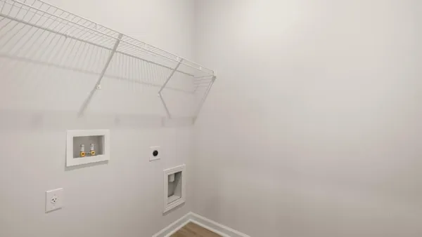 an aerial view of residential houses with outdoor space and river