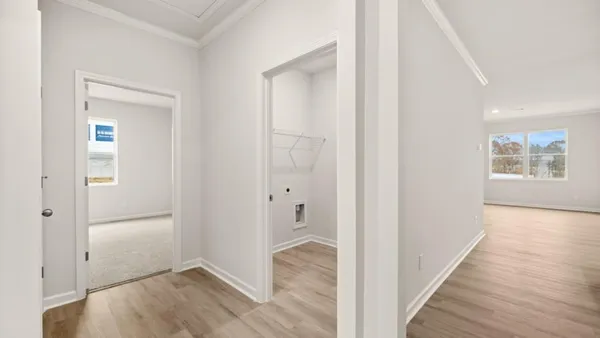 wooden floor with white walls
