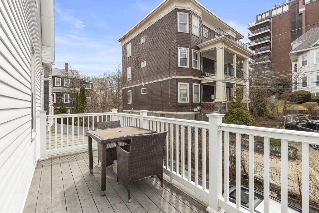 55 Main Street Somerville, MA 02145 - Photo 14 of 28 a view of a brick building from a deck