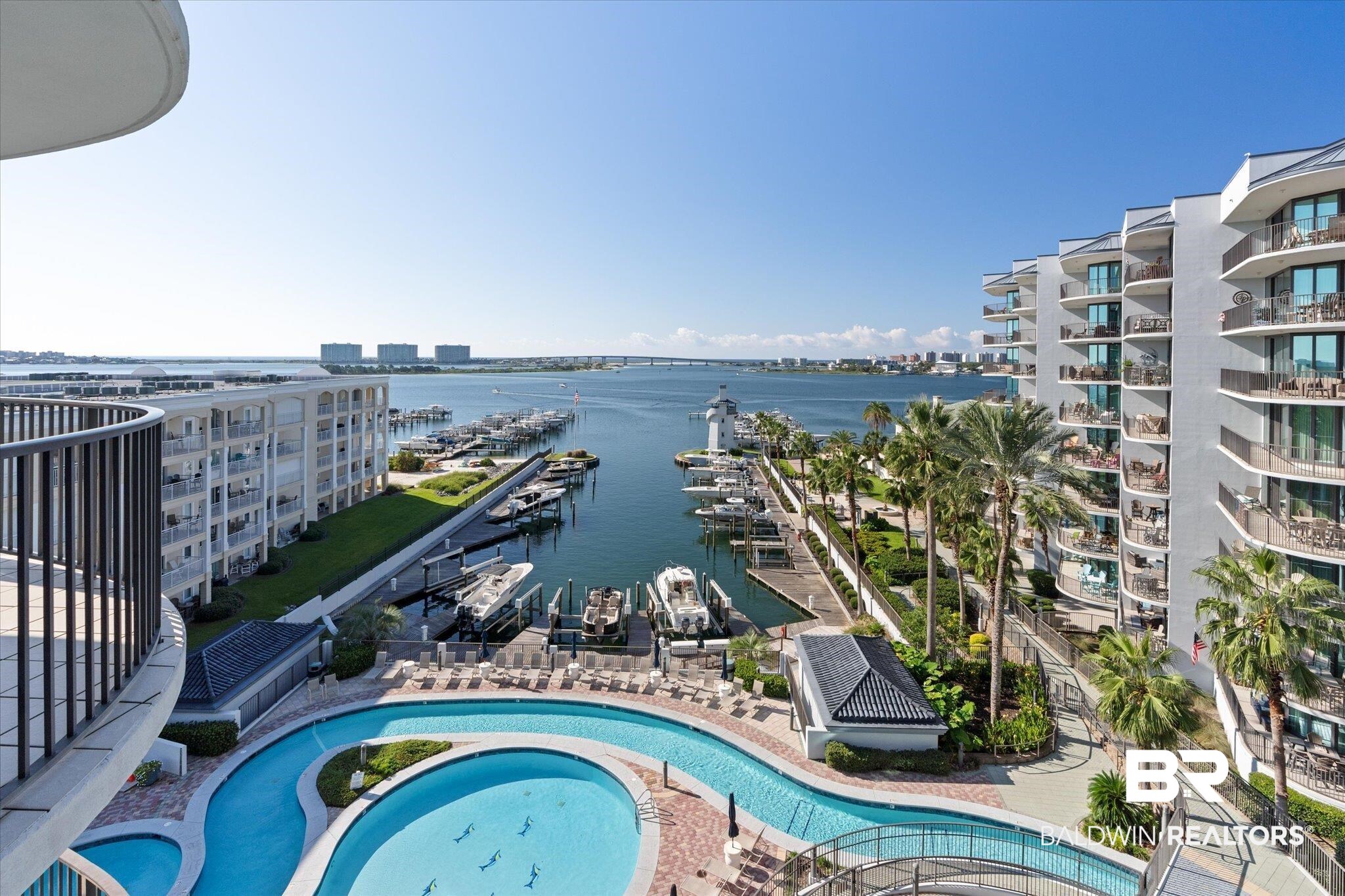 27582 Canal Road, Unit 2611 Orange Beach, AL 36561 - Photo 30 of 37 View of pool featuring a water view and a jacuzzi